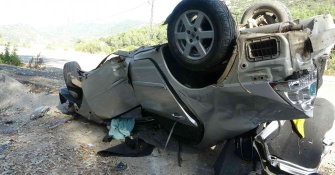 Takla atan otomobilin sürücüsü yaralı kurtuldu