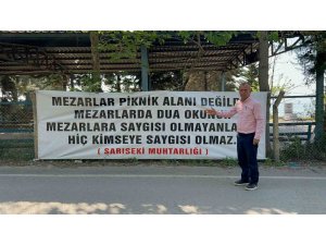 "Mezarlar piknik alanı değildir" diyen muhtar, mezarlıklarda pikniği yasakladı