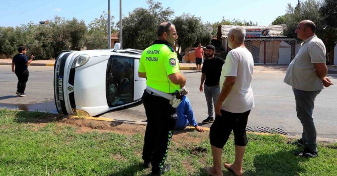 Yan yatıp sürüklenen araçtan yara almadan çıktılar