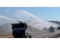Kontrol altına alınan orman yangınında peş peşe sıralanan TOMA’ların müdahalesi