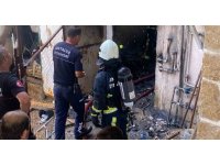 Depoda çıkan yangın eve sıçrar sıçramaz söndürüldü